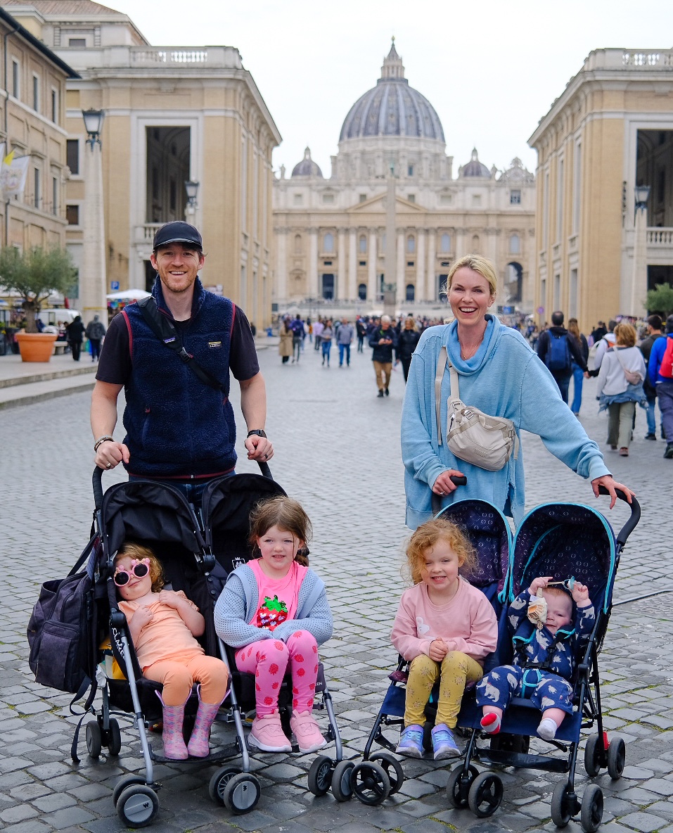 Sean with his wife and their four young children in front of St. Peter's Basilica in Rome